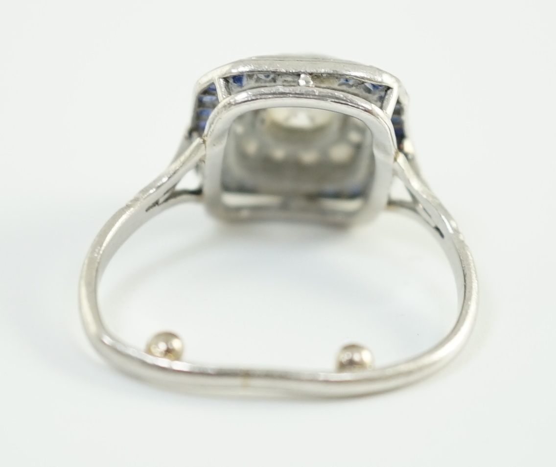 An Art Deco platinum, diamond and sapphire set rectangular cluster ring